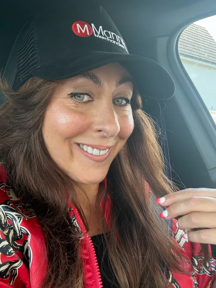 Arlene wearing a black Mannik cap