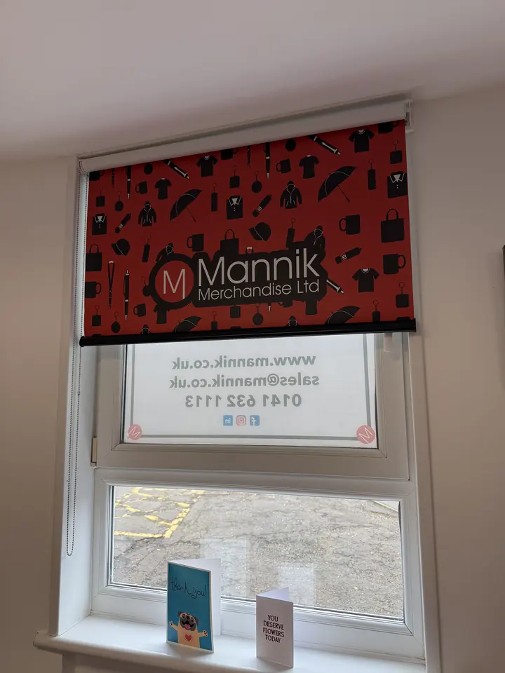 Office window blind printed with the Mannik icon pattern and logo